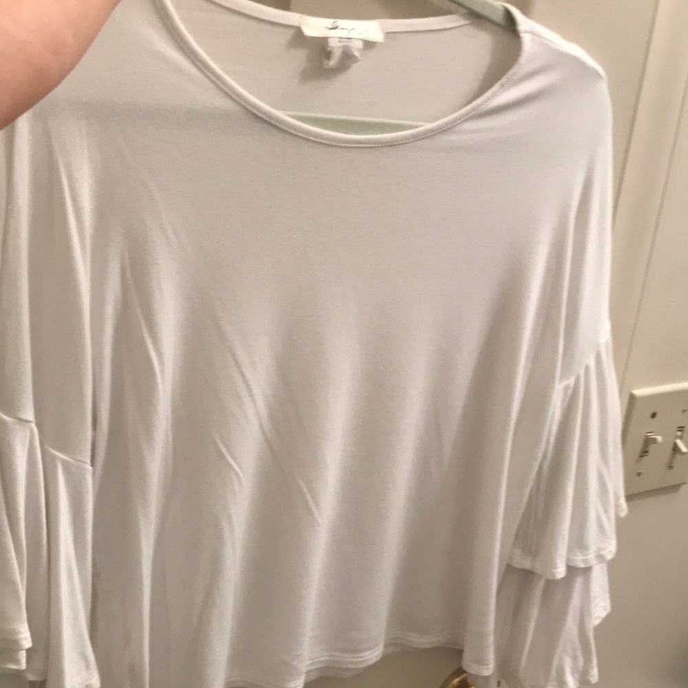 White blouse with ruffled sleeves